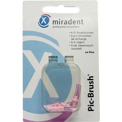 Verpackung mit sechs kleinen pinken Bürsten für Zahnreinigung.